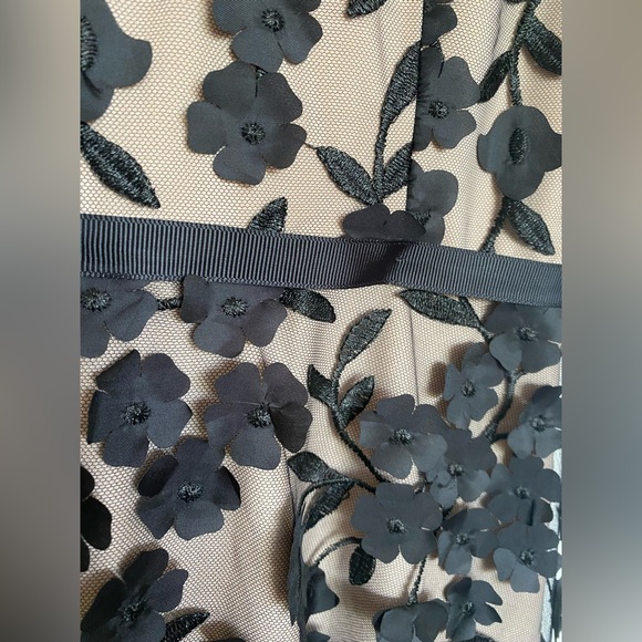 BHLDN nude gown with black mesh overlay, embroidery, and floral appliqué. - Picture 5 of 7